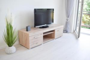 TV a/nebo společenská místnost v ubytování Ferienwohnung Meeresstrand
