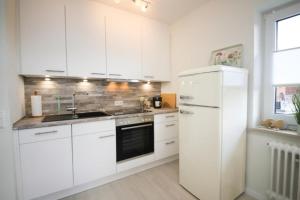Kuchyň nebo kuchyňský kout v ubytování Ferienwohnung Meeresstrand