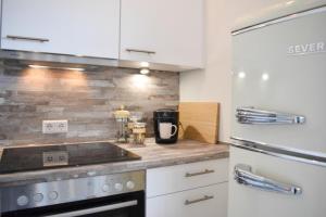 Kuchyň nebo kuchyňský kout v ubytování Ferienwohnung Meeresstrand