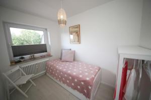 Postel nebo postele na pokoji v ubytování Ferienwohnung Meeresstrand