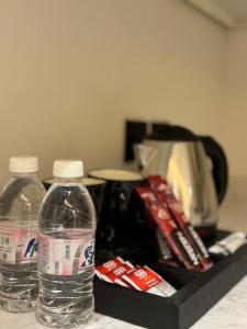 two bottles of water sitting on top of a counter at فندق اللحظات السعيدة in Riyadh +7 photos