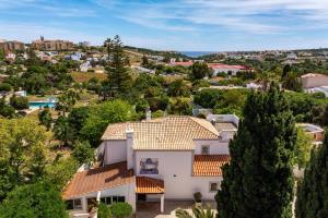 an aerial view of a house with trees at Luxury Casa Madeira, HEATED Salt Water Pool and Panoramic Woodfire Sauna in Lagos