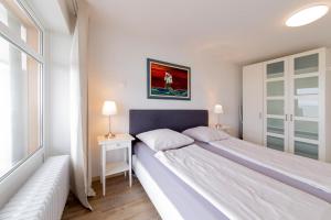Postel nebo postele na pokoji v ubytování Ferienwohnung Muschelsucher