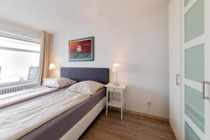 Postel nebo postele na pokoji v ubytování Ferienwohnung Muschelsucher