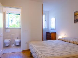 A bed or beds in a room at Residence Augusto