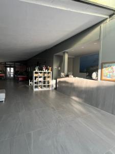 a large room with a large tile floor and a room with at Dela in Hvar