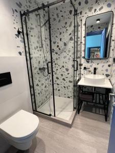 a bathroom with a shower and a toilet and a sink at Apartment Batumi Weekend in Batumi +209 photos