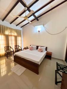 Postel nebo postele na pokoji v ubytování Ceylon Valley Villa