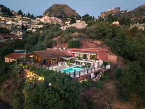 an aerial view of a house with a swimming pool at Villa del Sole in Taormina