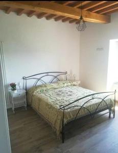 A bed or beds in a room at Agriturismo Il Bel Vedere