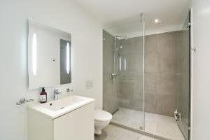 a bathroom with a shower and a toilet and a sink at Eksklusiv-nordisk-topbelligenhed in Copenhagen +22 photos