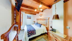 Postel nebo postele na pokoji v ubytování HOTEL CASA BAEZ