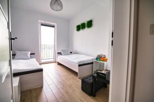 Posteľ alebo postele v izbe v ubytovaní Apartament The Palm 35 by Housine