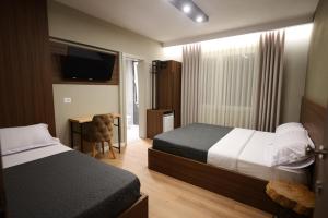 Hotel Ikona客房内的一张或多张床位