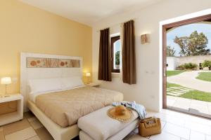 Postel nebo postele na pokoji v ubytování Masseria Corda Di Lana Hotel & Resort