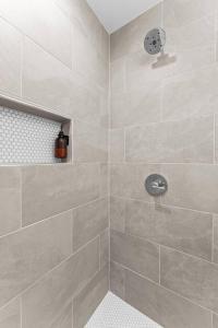 a bathroom with a large shower with a shower at Casita Fulton - Fire Pit & Close to Main St in Fredericksburg