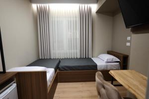 Hotel Ikona客房内的一张或多张床位