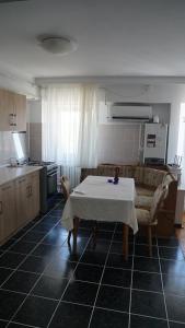 a living room with a table and a couch at Apart Portul Turistic in Mangalia