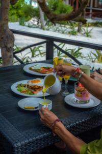 a table with two plates of food on it at BT Live Tulum located at the party zone in Tulum