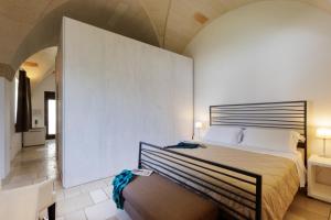 Postel nebo postele na pokoji v ubytování Masseria Corda Di Lana Hotel & Resort
