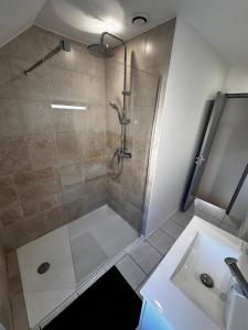 a bathroom with a shower and a sink at Maison entre Terre et Mer in Blainville-sur-Orne