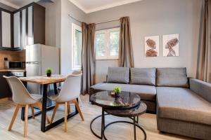 a living room with a couch and a table at Agora Apartments in Mytilene