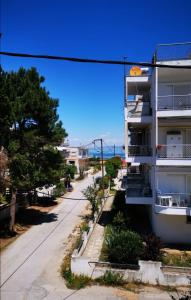 an empty street in front of a building at Seaside BLISS in Agia Triada