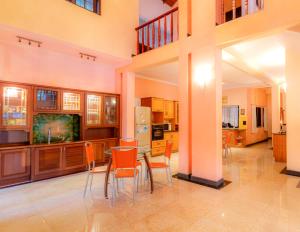 a kitchen with a table and chairs in a room at Starry Boutique in Kandy