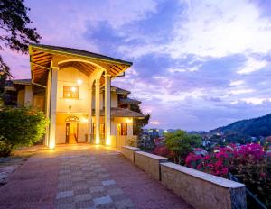 a house with a pathway leading up to it at Starry Boutique in Kandy