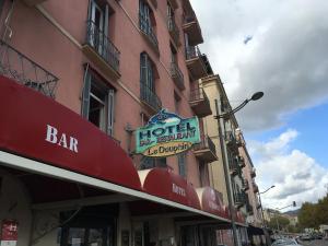 a hotel sign on the side of a building at Hotel le Dauphin in Ajaccio