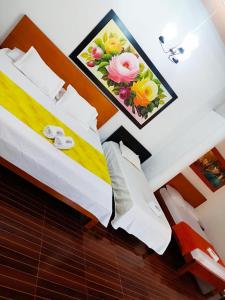 Postel nebo postele na pokoji v ubytování Hotel El Bosque Valledupar