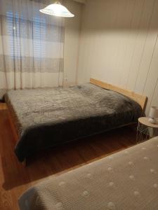 Ein Bett oder Betten in einem Zimmer der Unterkunft Apartments Knežević