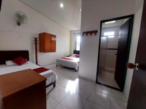 Postel nebo postele na pokoji v ubytování Hotel PARAMO LIDERATO