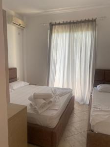 Postel nebo postele na pokoji v ubytování Hotel Dini