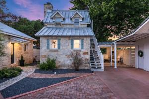 a house with a tower on top of it at Stonewall Bungalows - Sleeps 15 in Stonewall