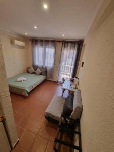 Postel nebo postele na pokoji v ubytování Astro Studio Apartments