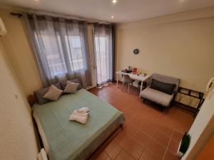 Postel nebo postele na pokoji v ubytování Astro Studio Apartments