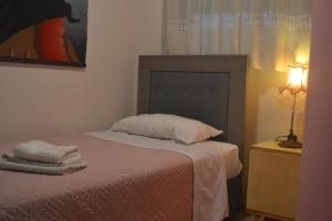 Postel nebo postele na pokoji v ubytování Alexandra's Relaxing Suite
