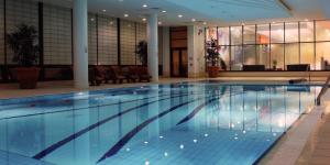 a large swimming pool in a building at Clayton Whites Hotel in Wexford