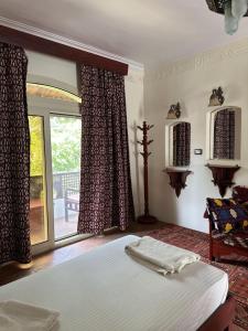 Postel nebo postele na pokoji v ubytování Ali Baba Hotel