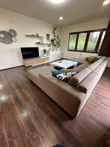 a large living room with a couch and a table at Casa Lila in Sarajevo +8 photos