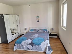 a bedroom with a bed and a large mirror at Studio Anelia in Sveti Vlas +13 photos