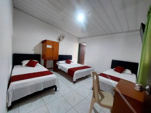 Postel nebo postele na pokoji v ubytování Hotel PARAMO LIDERATO