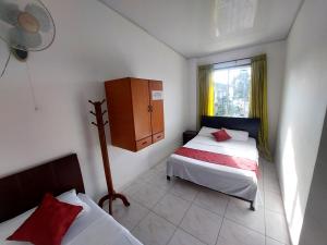 Postel nebo postele na pokoji v ubytování Hotel PARAMO LIDERATO