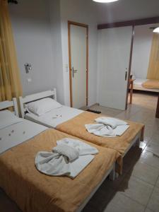 Postel nebo postele na pokoji v ubytování Alexandra Studios