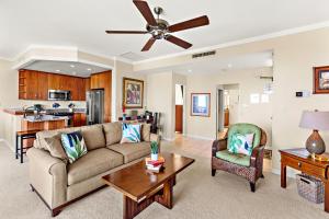 a living room with a couch and a table at Kapalua Golf Villa 20V 1 in Kahana