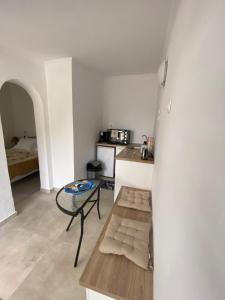 a living room with a bench and a table at Vivaria House in Paleokastritsa