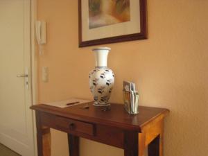 a vase sitting on a table in a room at Relaxa at a luxurious villa in Bad Pyrmont in Bad Pyrmont