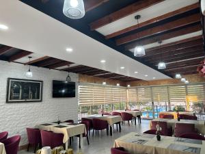 TV a/nebo společenská místnost v ubytování Hotel Halibas