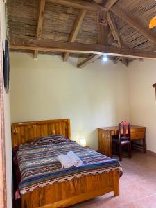 Postel nebo postele na pokoji v ubytování Casa Hotel Loma Wasi en Cotacachi